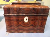 Wooden tea caddy from China. On display at the Museum of Liverpool, England